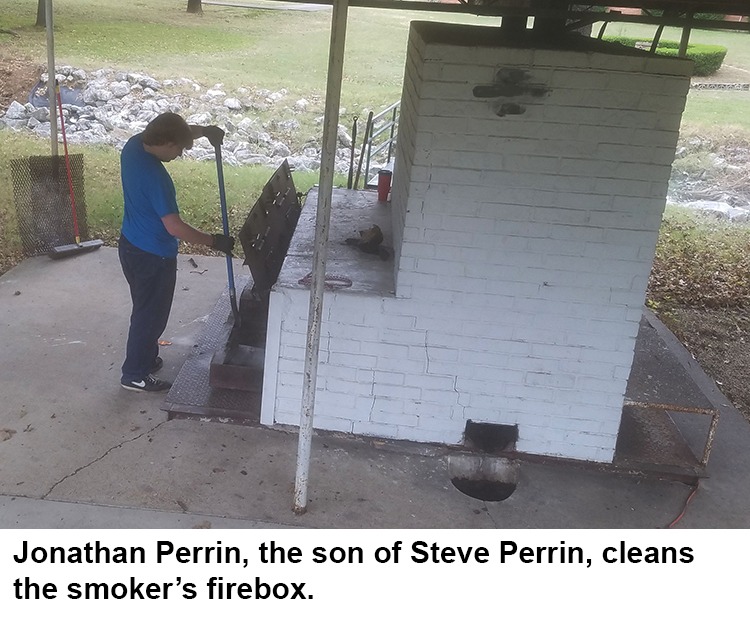 Jonathan cleaning the firebox